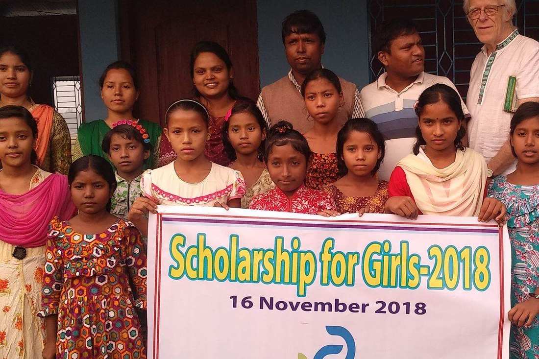 A scholarship cheque handed to a student
